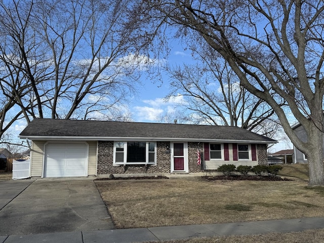 ranch-style house with a garage, driveway, a front lawn, and brick siding