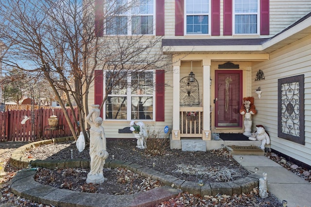 view of property exterior featuring a garage, aphalt driveway, and fence