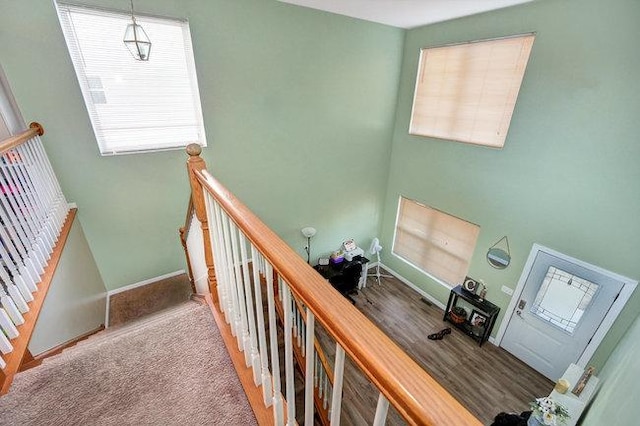 stairs with carpet and baseboards