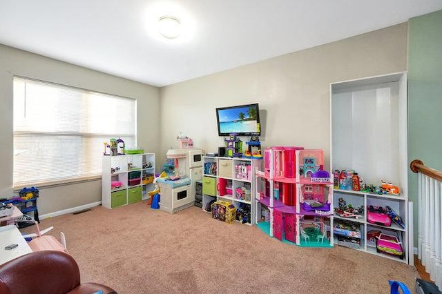 playroom featuring carpet flooring, visible vents, and baseboards