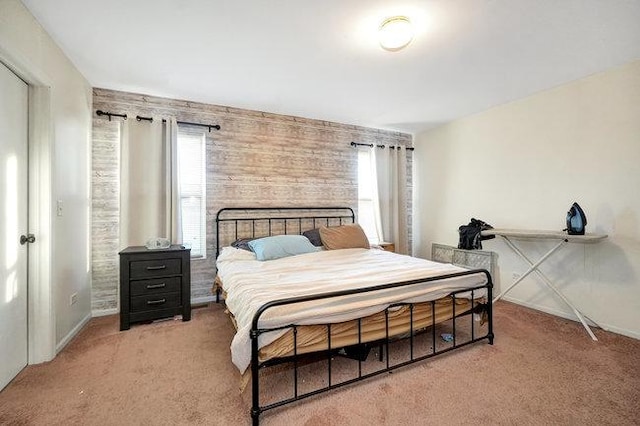 bedroom featuring carpet and baseboards