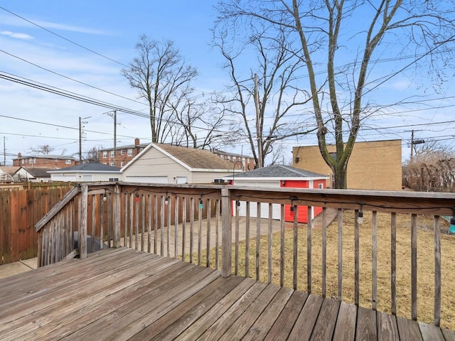 wooden deck featuring a lawn and fence