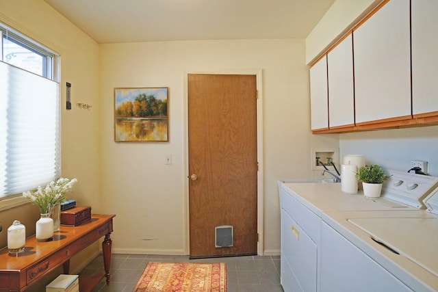 washroom with visible vents, washing machine and dryer, cabinet space, and tile patterned floors