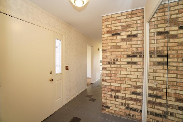 entrance foyer with dark tile patterned flooring