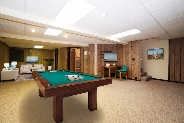 recreation room with a paneled ceiling, pool table, wooden walls, and baseboards