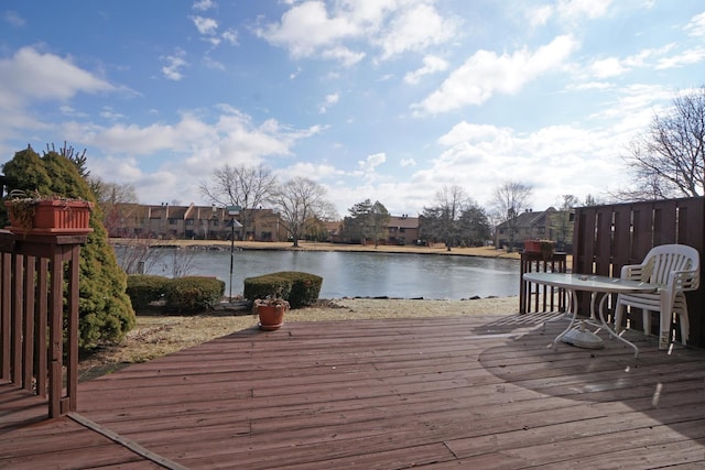 wooden deck featuring a water view