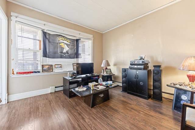 home office featuring wood finished floors, baseboards, baseboard heating, and ornamental molding