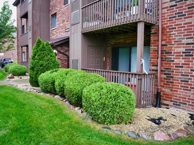 exterior space with brick siding