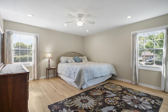 bedroom featuring baseboards, ceiling fan, recessed lighting, and light wood-style floors