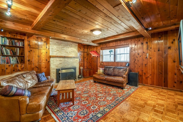 living area featuring wooden ceiling, wood walls, and beamed ceiling