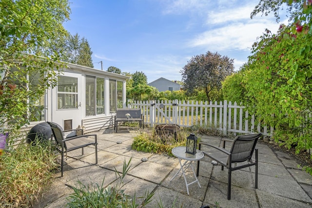 view of patio featuring fence