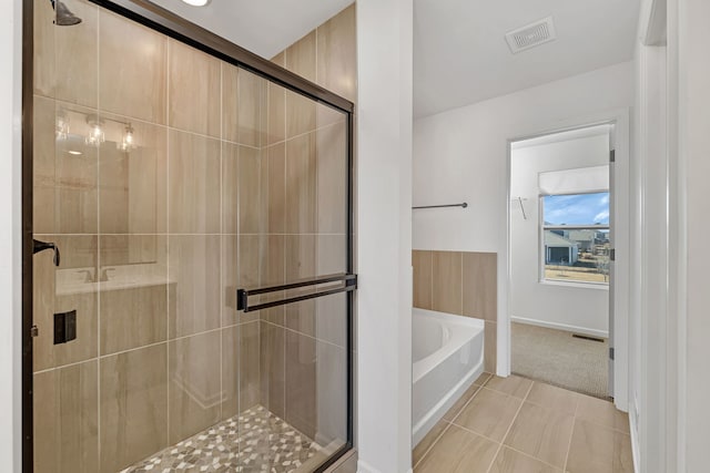 733 Juniper St, Oswego, IL 60543 - full bathroom with a garden tub, a shower stall, and tile patterned flooring