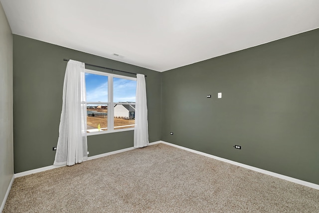 733 Juniper St, Oswego, IL 60543 - carpeted empty room featuring baseboards