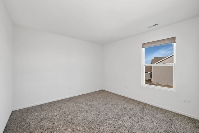 733 Juniper St, Oswego, IL 60543 - carpeted empty room featuring baseboards