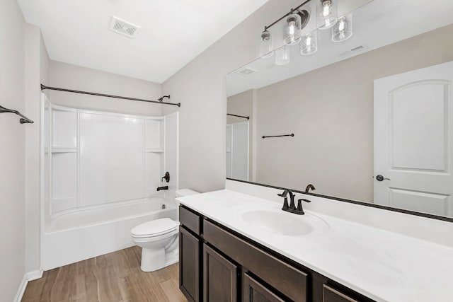 733 Juniper St, Oswego, IL 60543 - bathroom featuring vanity, wood finished floors, and  shower combination