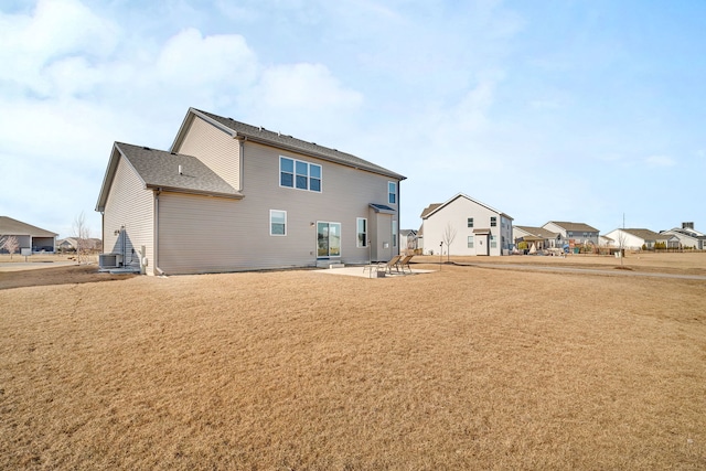 733 Juniper St, Oswego, IL 60543 - rear view of property featuring a patio, a residential view, and a yard