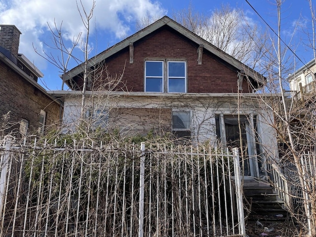 view of property exterior featuring brick siding