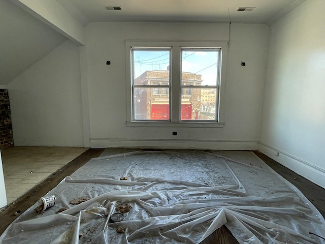 7310 S Kingston Ave, Chicago, IL 60649 - additional living space with visible vents and baseboards