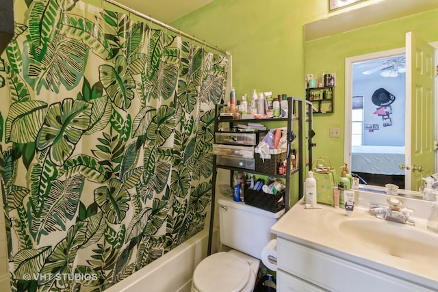 bathroom with toilet, vanity, shower / bath combo with shower curtain, and ensuite bathroom