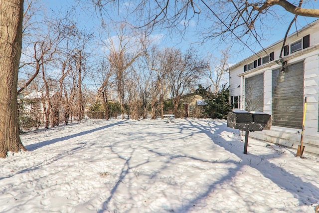 view of yard layered in snow