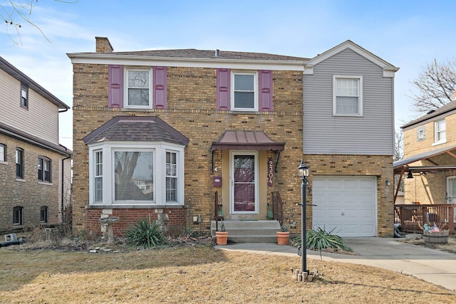 view of front of house with a garage, concrete driveway, brick siding, and a chimney