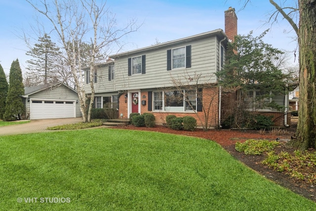 colonial inspired home featuring a garage, brick siding, a chimney, and a front lawn