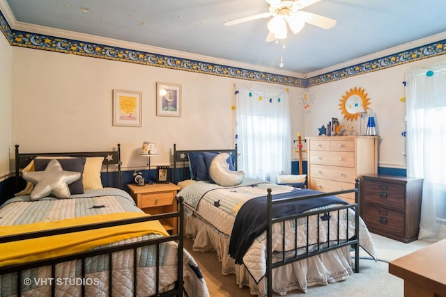 carpeted bedroom with ornamental molding