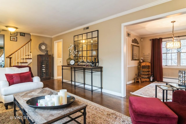 living room with stairway, visible vents, wood finished floors, and ornamental molding