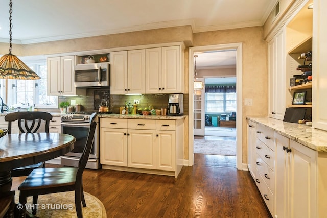 kitchen with appliances with stainless steel finishes, dark wood-type flooring, ornamental molding, and open shelves