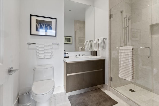 full bath featuring a stall shower, vanity, and toilet