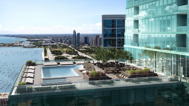 exterior space with a water view and a city view