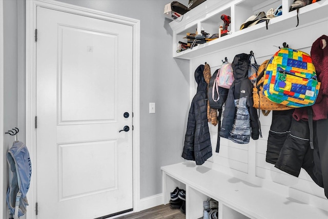 mudroom featuring baseboards and wood finished floors