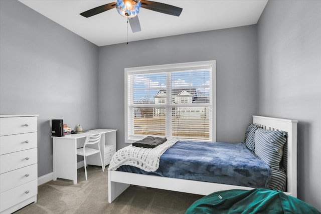 bedroom featuring ceiling fan and light carpet