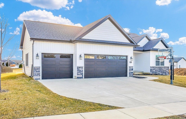 modern farmhouse with a front yard, an attached garage, driveway, and roof with shingles