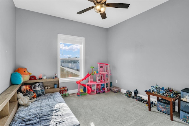 carpeted bedroom featuring a ceiling fan and baseboards