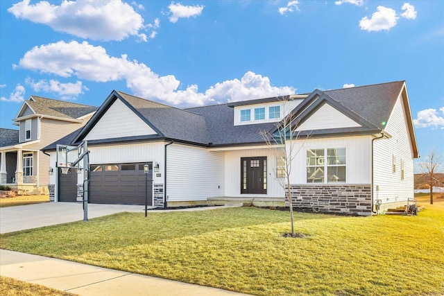 view of front of home with an attached garage, driveway, a front lawn, and roof with shingles