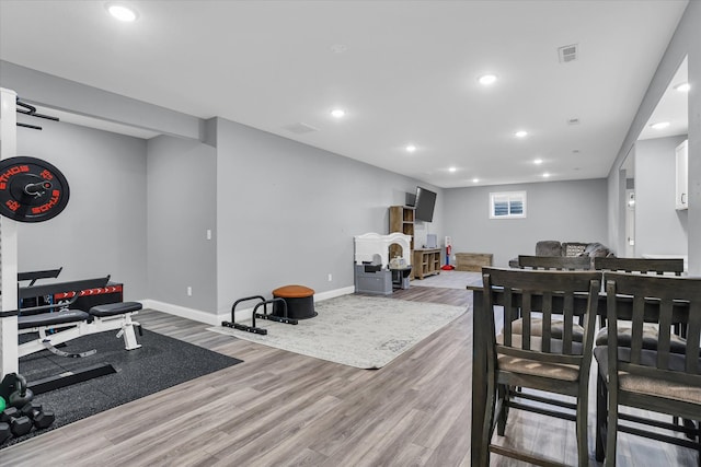 interior space with recessed lighting, visible vents, baseboards, and wood finished floors