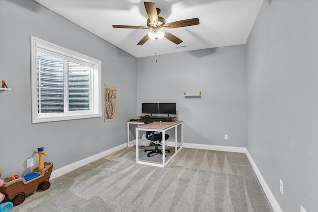 home office featuring visible vents, carpet flooring, baseboards, and ceiling fan