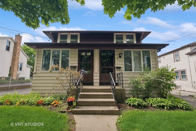 bungalow with fence and a porch