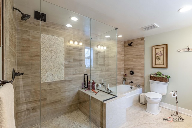 bathroom with a tub to relax in, visible vents, toilet, a tile shower, and baseboards