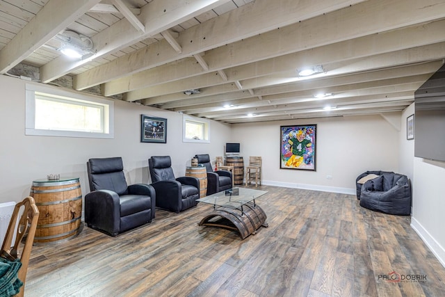 living area featuring wooden ceiling, wood finished floors, beam ceiling, and baseboards