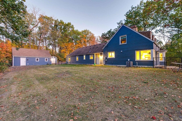 back of house with a yard and fence