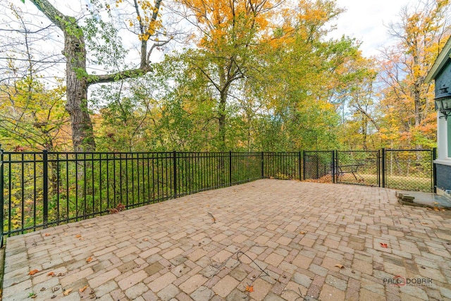 view of patio / terrace featuring a gate and fence