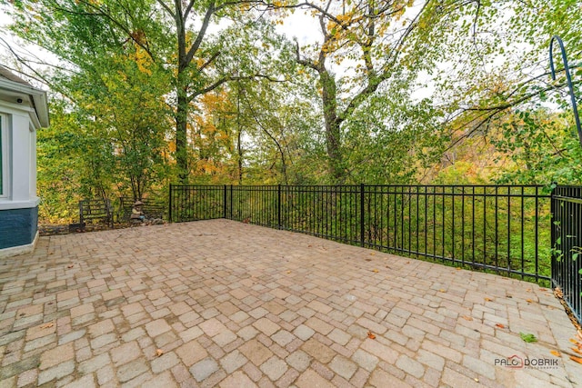 view of patio featuring fence