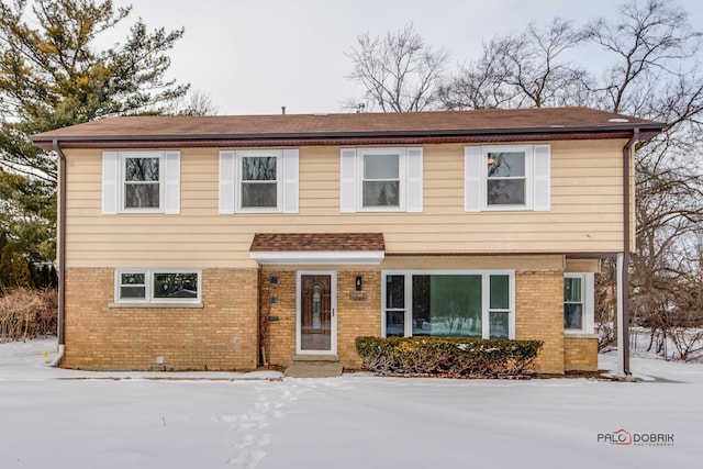 view of front of home with brick siding