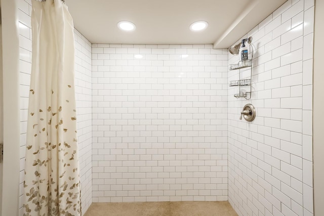 full bath with recessed lighting and a tile shower