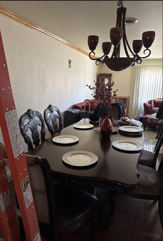 dining room featuring crown molding