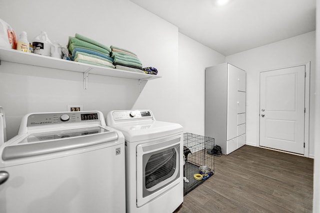 laundry room featuring dark wood-style floors, laundry area, and separate washer and dryer