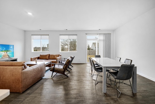 dining room with baseboards, dark wood finished floors, and recessed lighting