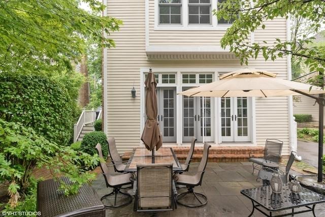 exterior space featuring french doors, a patio area, and outdoor dining area